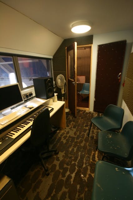 Recording studio at The Harrow Club, soundproofed space for workshops and podcasts.